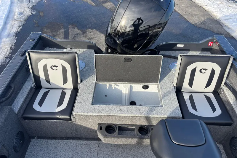 Slide: The Image of 2026 Crestliner 1850 Fish Hawk WT JS boat interior with seating and storage compartments. - 3