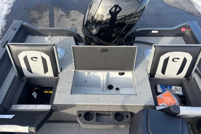 Slide: The Image of 2026 Crestliner 1850 Fish Hawk WT JS boat interior with storage compartments and seating. - 4