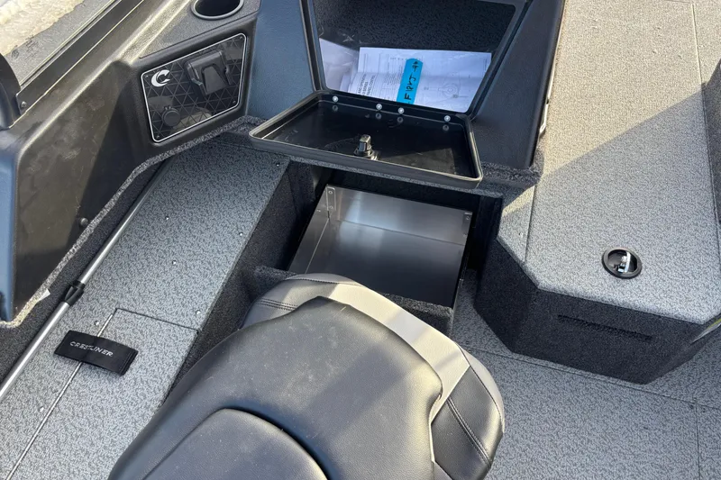 Slide: The Image of Interior of 2026 Crestliner 1850 Fish Hawk WT JS boat, featuring storage compartments. - 6