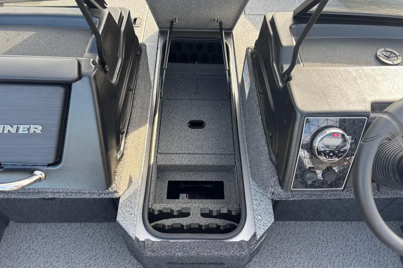 Slide: The Image of 2026 Crestliner 1850 Fish Hawk WT JS boat interior with storage and control panel. - 7