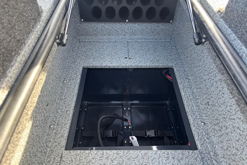 Slide: The Image of 2026 Crestliner 1850 Fish Hawk WT JS boat storage compartment, featuring durable interior design. - 8