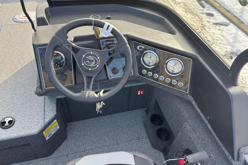 Slide: The Image of 2026 Crestliner 1850 Fish Hawk WT JS dashboard with steering wheel and gauges. - 9
