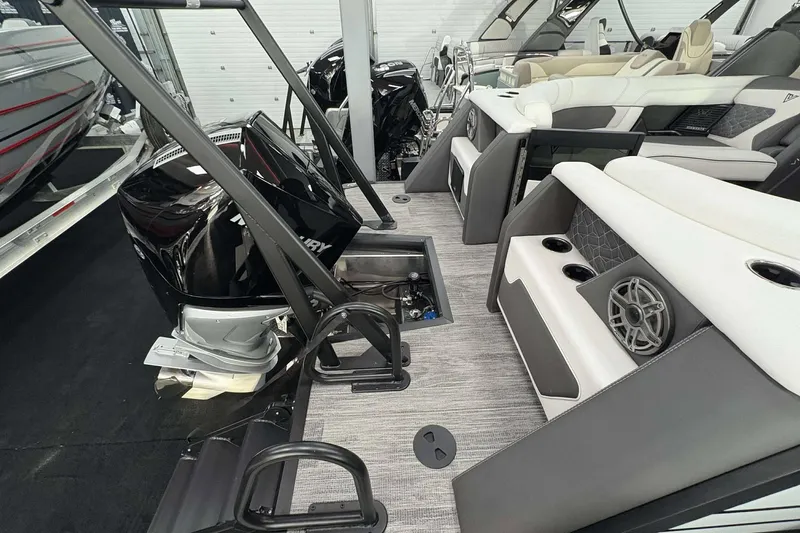 Slide: The Image of 2026 Viaggio D24U A-T boat interior with seating, speakers, and Mercury outboard motor. - 13