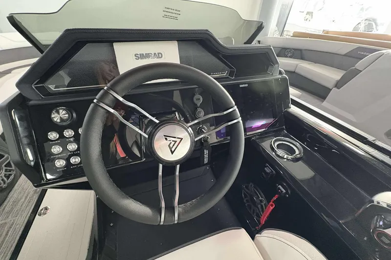 Slide: The Image of 2026 Viaggio D24U A-T boat dashboard with steering wheel and Simrad display. - 20