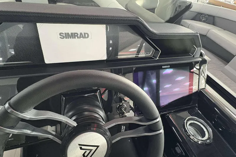 Slide: The Image of Steering wheel and dashboard of 2026 Viaggio D24U A-T boat with Simrad display. - 8