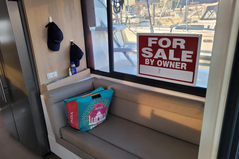 Slide: The Image of 2019 Bali 4.3 yacht interior with "For Sale by Owner" sign on window. - 15