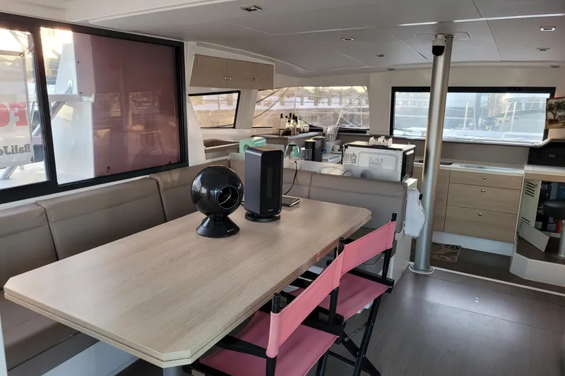 Slide: The Image of Interior of 2019 Bali 4.3 catamaran with modern dining area and kitchen. - 17
