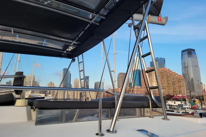 Slide: The Image of Bali 4.3 catamaran deck with city skyline in the background, 2019 model. - 21