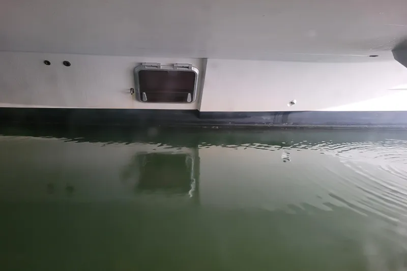 Slide: The Image of Bali 4.3 catamaran hull above calm water, 2019 model. - 27