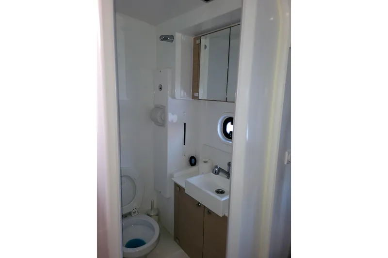 Slide: The Image of Compact bathroom in a 2019 Bali 4.3 model yacht, featuring a toilet and sink. - 35