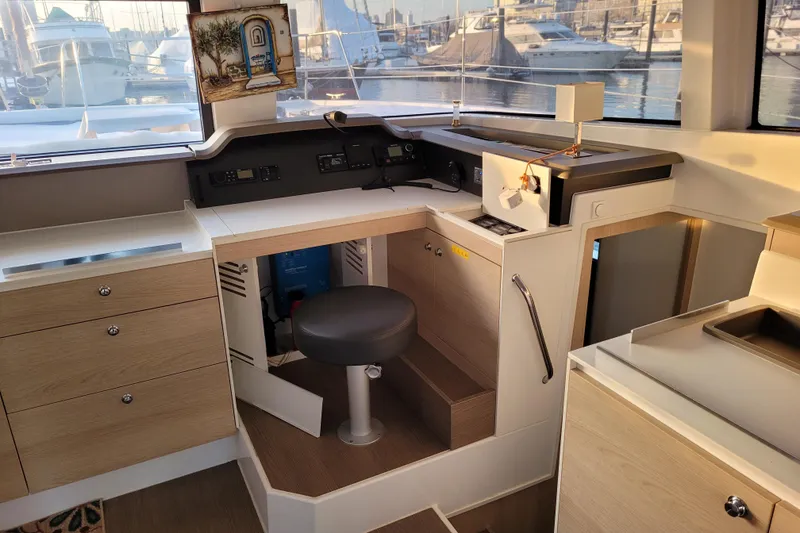 Slide: The Image of Interior of a 2019 Bali 4.3 yacht with modern navigation station and marina view. - 5
