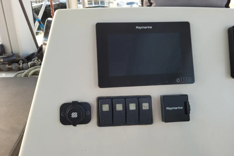 Slide: The Image of Control panel of a 2019 Bali 4.3 catamaran with Raymarine display and switches. - 51