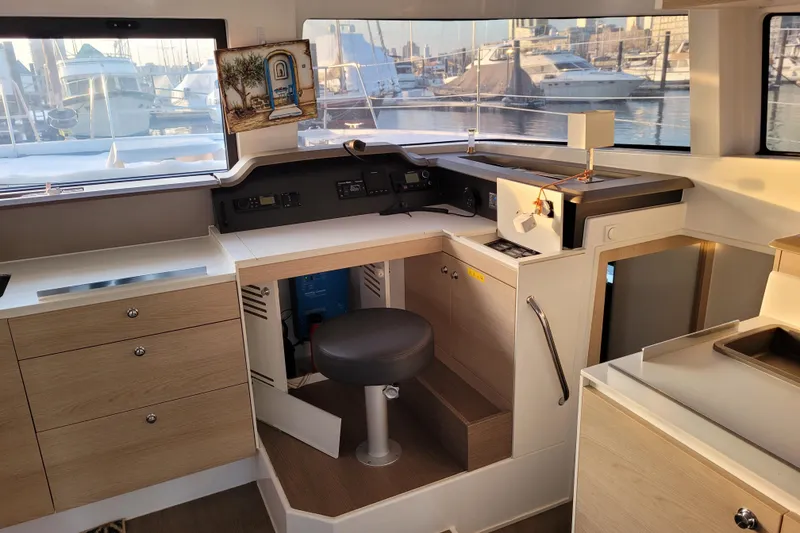 Slide: The Image of Modern 2019 Bali 4.3 yacht interior with helm station and marina view. - 6