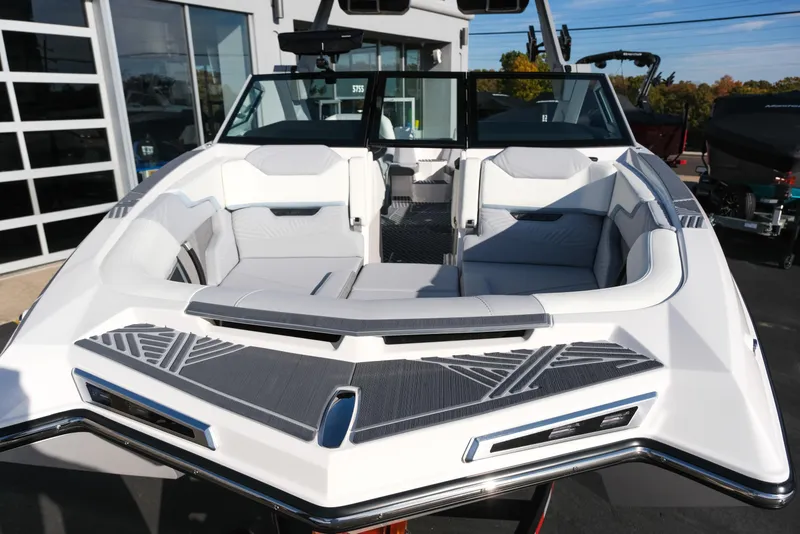 Slide: The Image of 2026 MasterCraft XStar 25 boat with sleek white and gray interior design. - 10