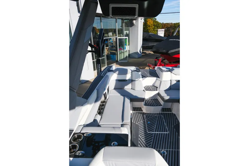 Slide: The Image of 2026 MasterCraft XStar 25 boat interior with sleek seating and modern design. - 19