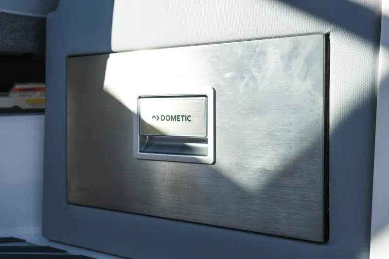 Slide: The Image of Stainless steel Dometic panel on 2026 MasterCraft XStar 25 boat interior. - 23