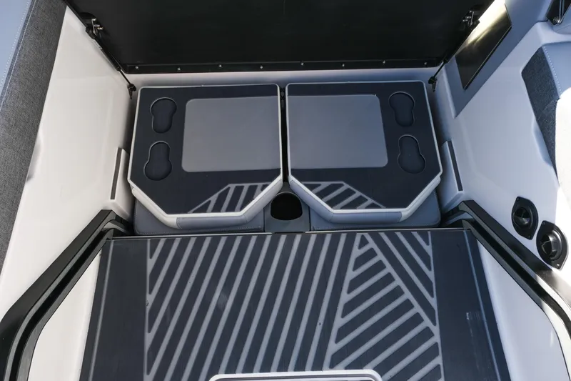 Slide: The Image of Interior of 2026 MasterCraft XStar 25 boat with modern seating and cup holders. - 27