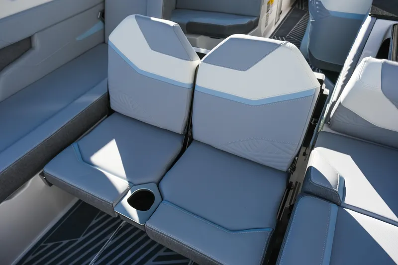 Slide: The Image of 2026 MasterCraft XStar 25 interior seating with cup holder, featuring modern design and comfort. - 28