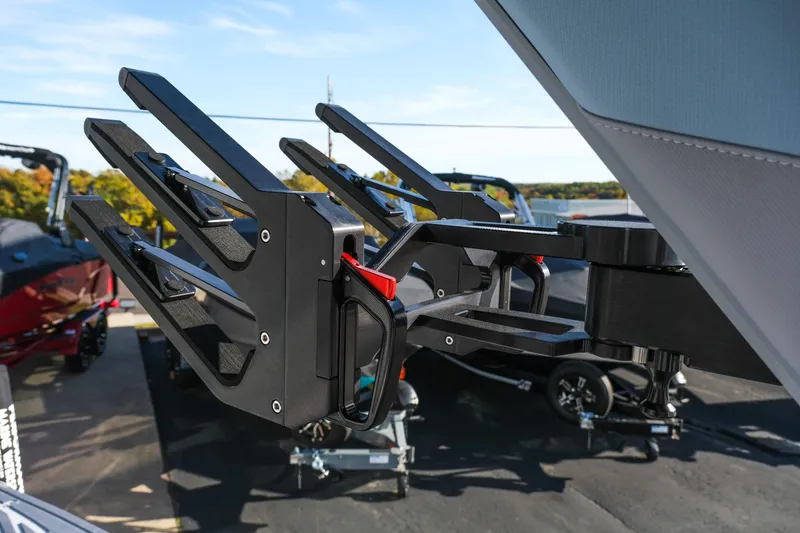 Slide: The Image of 2026 MasterCraft XStar 25 boat accessory detail, featuring a sleek black wakeboard rack. - 29