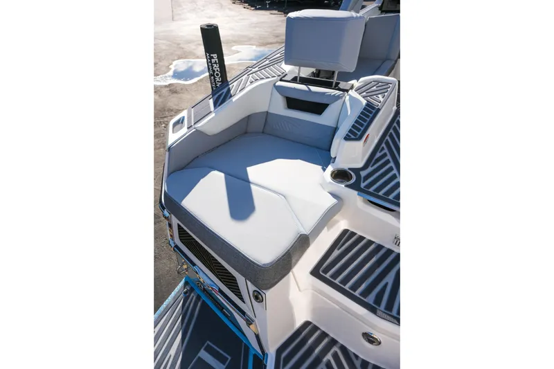 Slide: The Image of 2026 MasterCraft XStar 25 boat interior with cushioned seating and sleek design. - 32