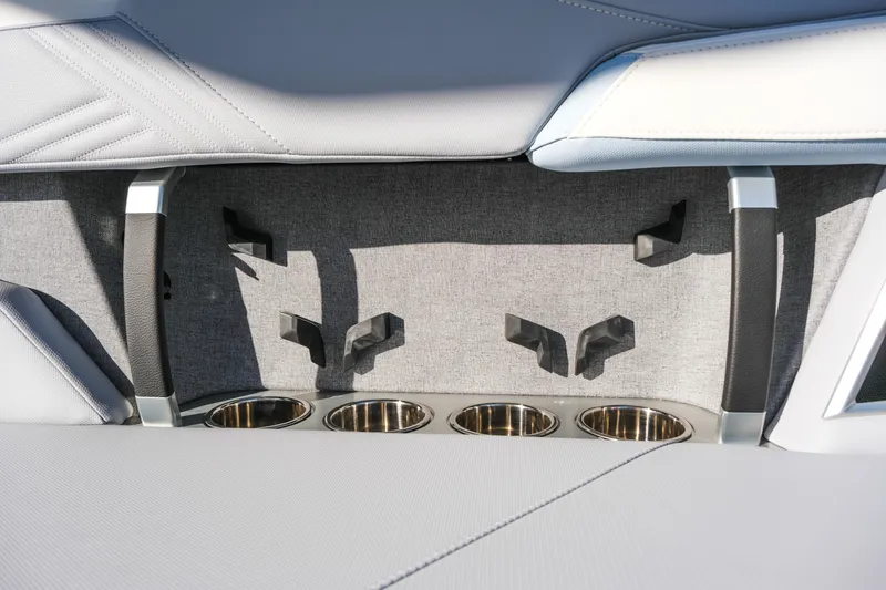 Slide: The Image of 2026 MasterCraft XStar 25 interior with cup holders and sleek seating design. - 41