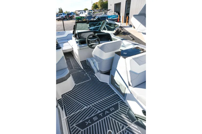 Slide: The Image of 2026 MasterCraft XStar 25 interior with modern seating and sleek dashboard design. - 44