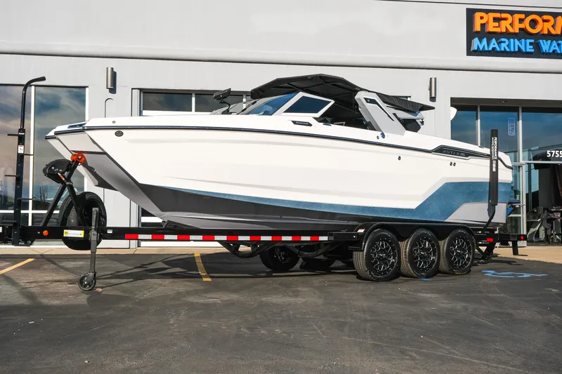 Slide: The Image of 2026 MasterCraft XStar 25 boat on trailer at Performance Marine Warehouse. - 48