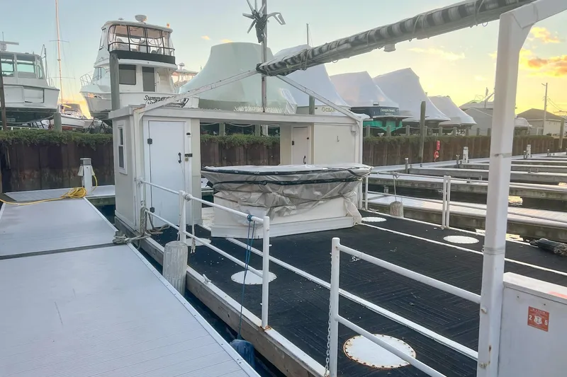 Slide: The Image of Floating dock with Custom MK1 model, 2022, at marina during sunset. - 2