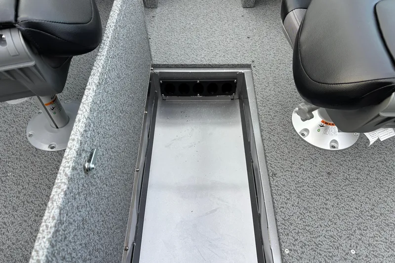 Slide: The Image of 2026 Crestliner 1650 Kodiak boat interior with storage compartment and seating. - 3