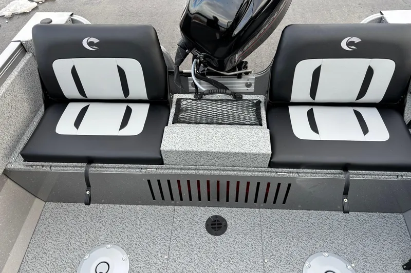 Slide: The Image of 2026 Crestliner 1650 Kodiak boat seats with motor, featuring sleek black and white design. - 5
