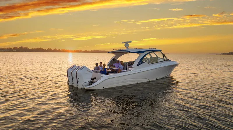 Slide: The Image of 2025 Fountain 39 DX boat cruising at sunset on calm waters. - 23