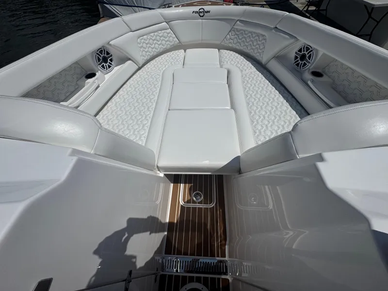 Slide: The Image of Luxurious seating area on a 2025 Fountain 39 DX boat with elegant white upholstery. - 24
