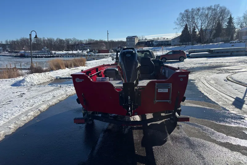 Slide: The Image of 2026 Crestliner 1650 Kodiak boat on snowy lakeside, rear view. - 9