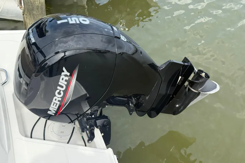 Slide: The Image of 2025 Bayliner VR6 Bowrider OB with Mercury outboard motor on water. - 11