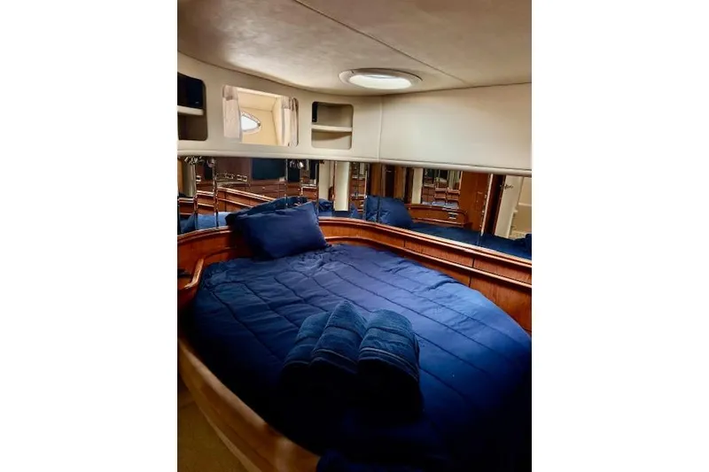 Slide: The Image of Luxurious cabin interior of 2001 Sea Ray Sundancer 540 yacht with cozy bedding. - 16