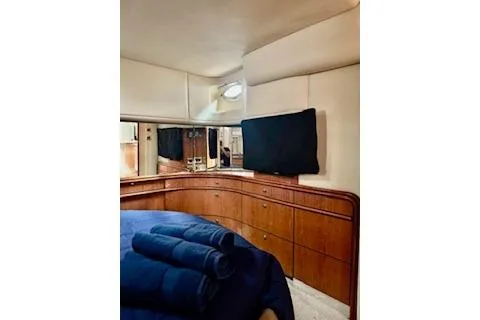 Slide: The Image of Luxurious interior of 2001 Sea Ray Sundancer 540 yacht with elegant wood cabinetry. - 17