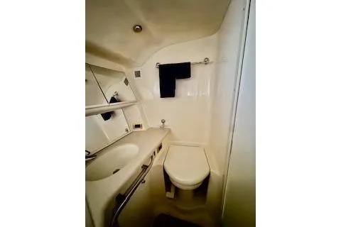 Slide: The Image of 2001 Sea Ray Sundancer 540 bathroom with sink, mirror, and toilet. - 25
