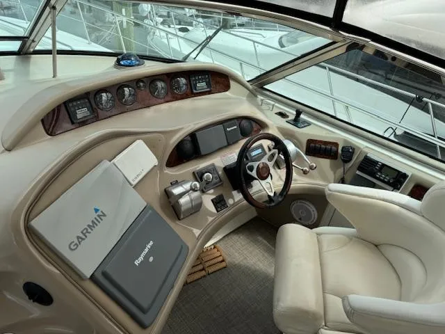 Slide: The Image of Interior helm of 2001 Sea Ray Sundancer 540 yacht with Garmin navigation system. - 38