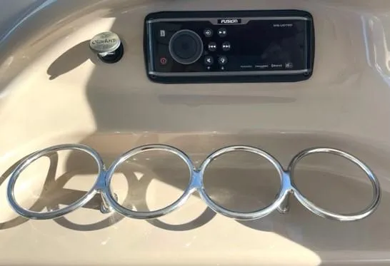 Slide: The Image of Control panel of 2001 Sea Ray Sundancer 540 with Fusion audio system and cup holders. - 44