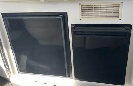 Slide: The Image of 2001 Sea Ray Sundancer 540 boat refrigerator and storage compartment. - 47