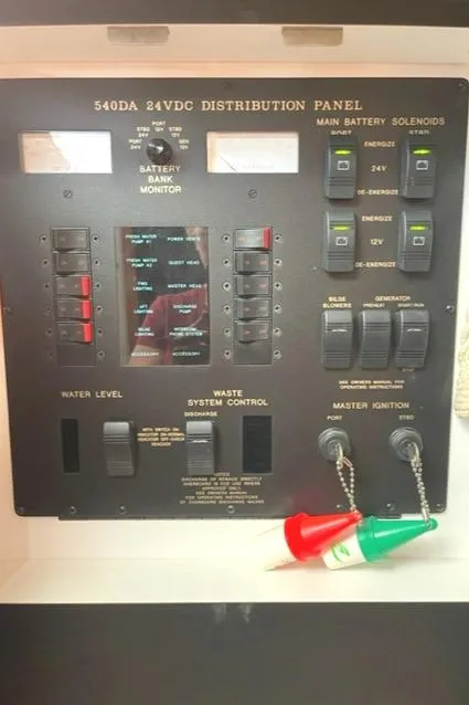 Slide: The Image of 2001 Sea Ray Sundancer 540 electrical distribution panel with switches and indicators. - 48