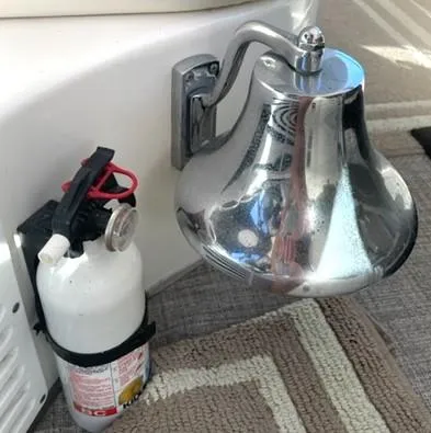 Slide: The Image of Chrome bell and fire extinguisher on 2001 Sea Ray Sundancer 540 yacht. - 49