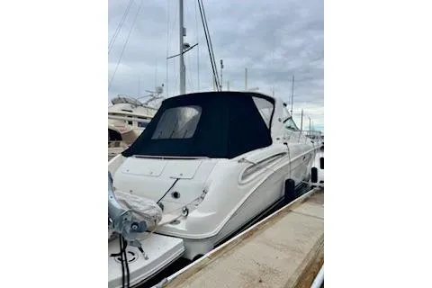 Slide: The Image of 2001 Sea Ray Sundancer 540 yacht docked at marina under cloudy sky. - 5