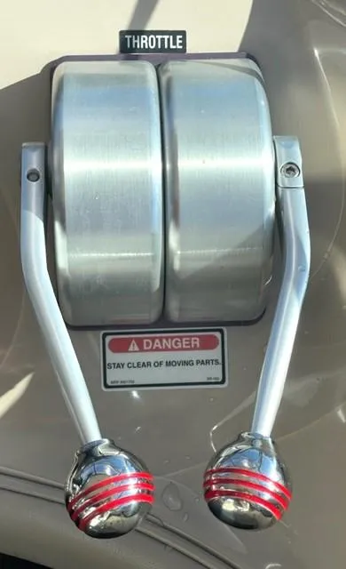 Slide: The Image of Throttle controls on a 2001 Sea Ray Sundancer 540 boat with safety warning label. - 57