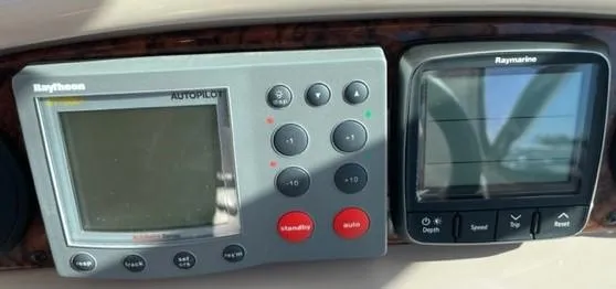 Slide: The Image of Raytheon autopilot and Raymarine display on 2001 Sea Ray Sundancer 540 yacht. - 60