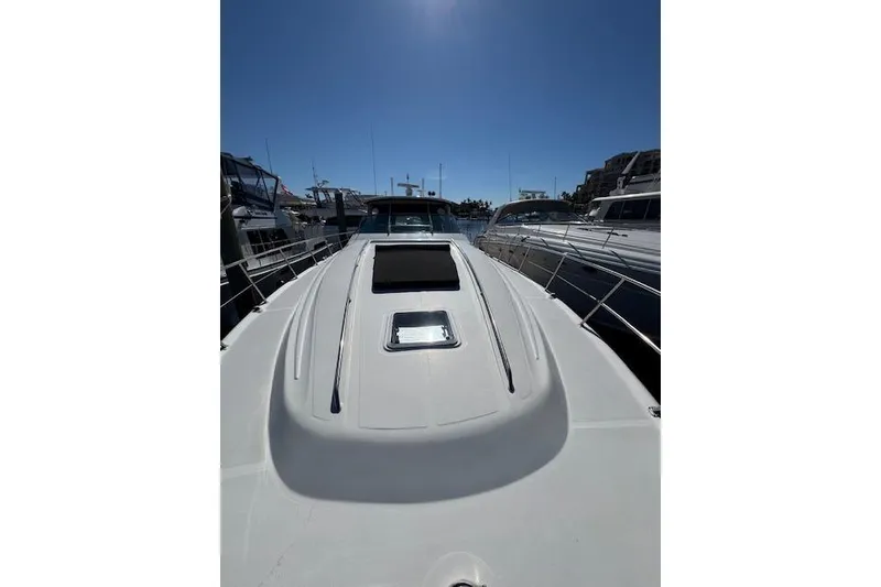 Slide: The Image of 2001 Sea Ray Sundancer 540 yacht docked under clear blue sky. - 85