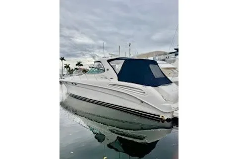Slide: The Image of 2001 Sea Ray Sundancer 540 yacht docked in marina, overcast sky. - 93