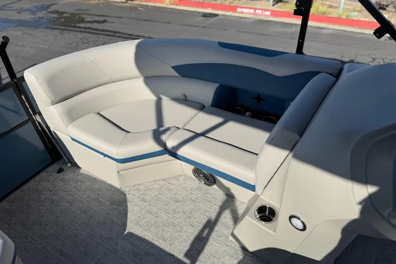 Slide: The Image of 2026 Berkshire 22RFX LE boat interior with plush seating and cup holders. - 11