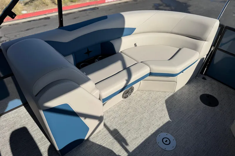 Slide: The Image of 2026 Berkshire 22RFX LE boat interior with blue and beige seating. - 18