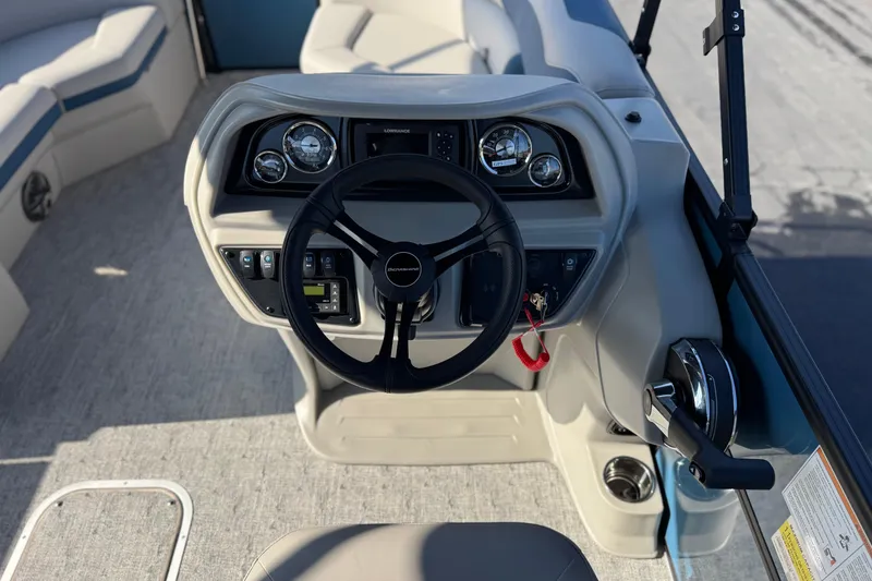 Slide: The Image of 2026 Berkshire 22RFX LE boat dashboard with steering wheel and control panel. - 23